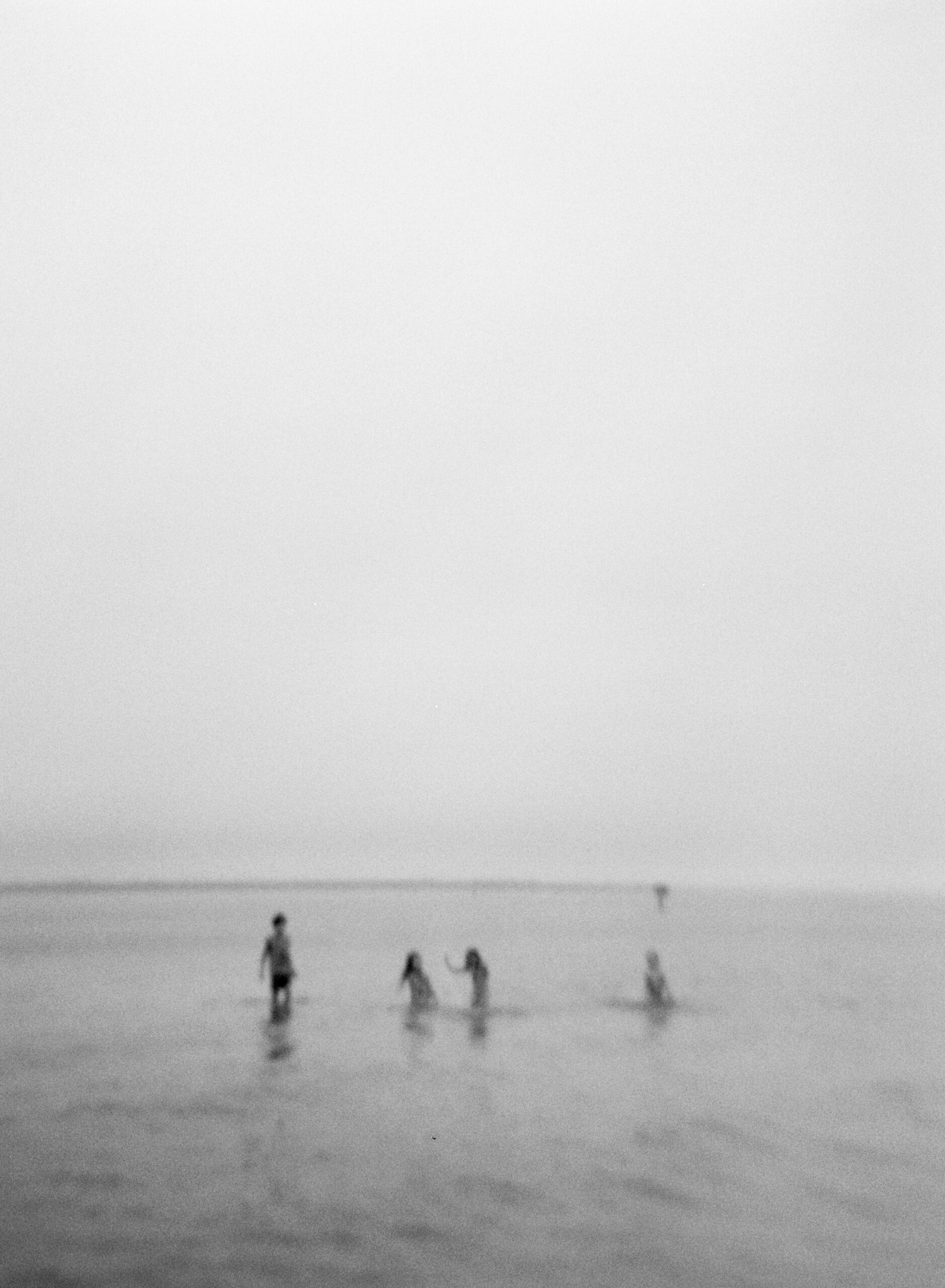 A group of kids swim in the Choctawhatchee Bay on Okaloosa Island.