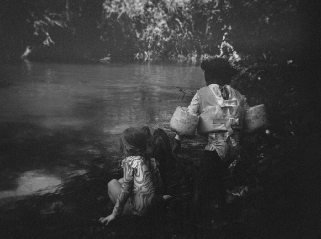 Kids getting ready to jump in the creek on a warm Summer day.