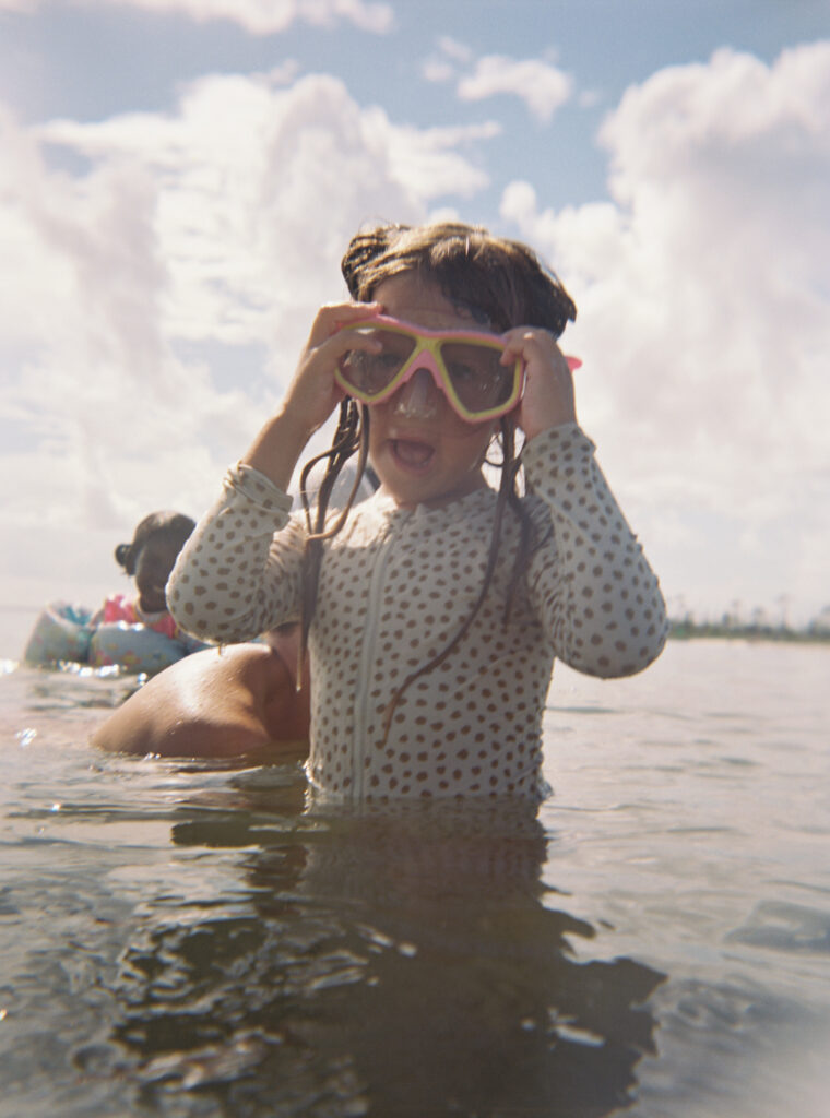 A young kid searches for shells in Cape San Blas State Park.
