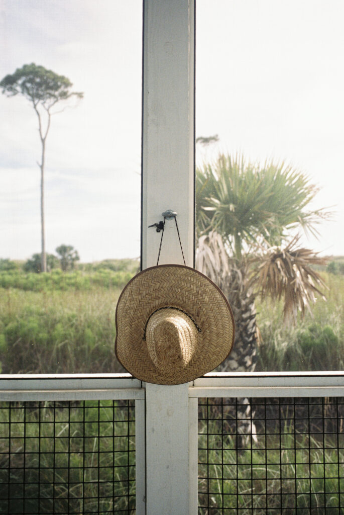 A sunhat hanging on the fence in Cape San Blas State Park.